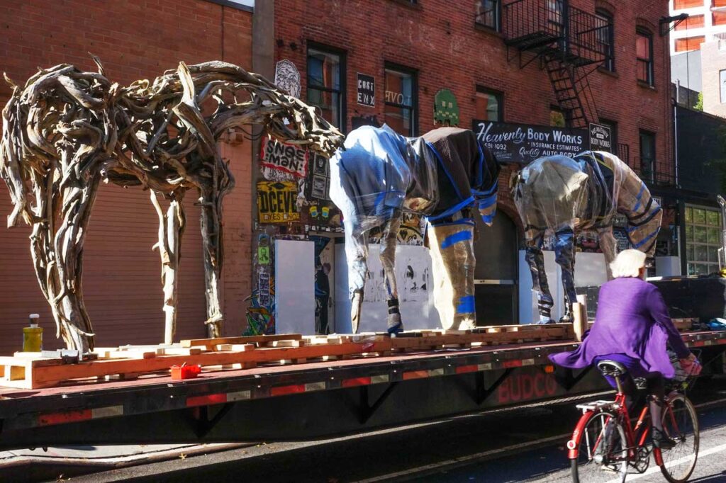 Sometimes you get lucky in the gallery district: three of Deborah Butterfield's horses from her 2014 exhibit at a 22nd Street gallery are loaded on a flatbed, ready for their next adventure. Photo: Annik LaFarge, author of On the High Line