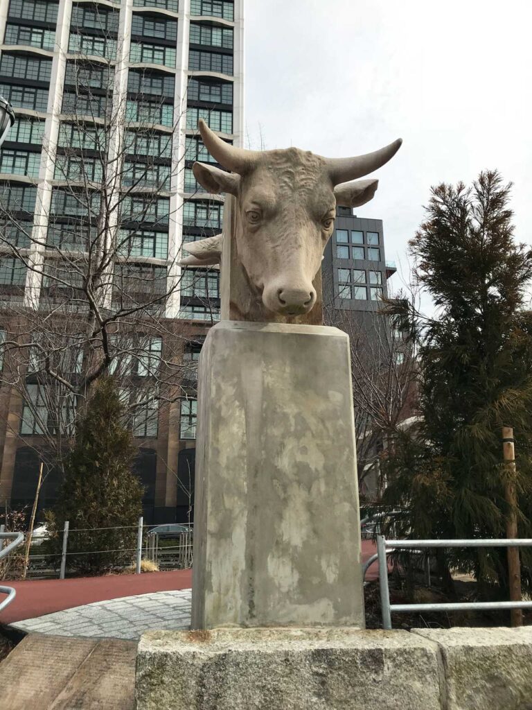 Limestone steer's head, once part of the facade of the New York Butchers' Dressed Meat Company on 11th Ave. between 39th & 40th Streets, designed by Horgan & Slattery. Today in Chelsea Waterside Park. Photo: Annik LaFarge, author of On the High Line