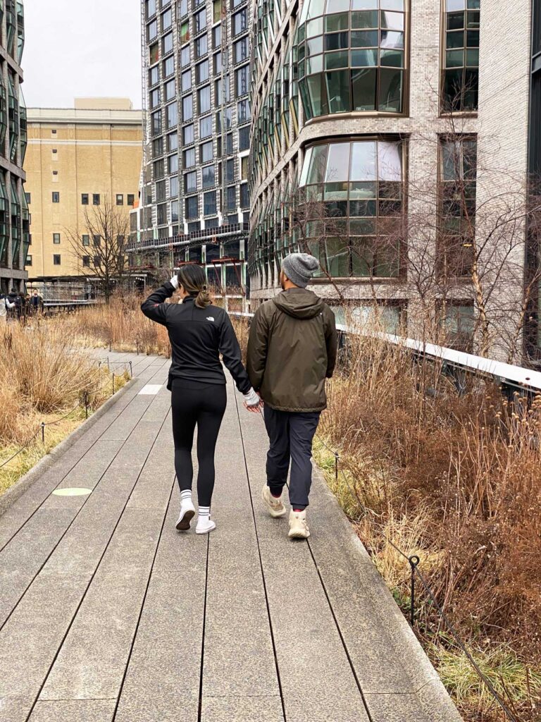 A couple holding hands on a winter walk through the Chelsea Grasslands, February 2022. Photo: Annik LaFarge, author of On the High Line