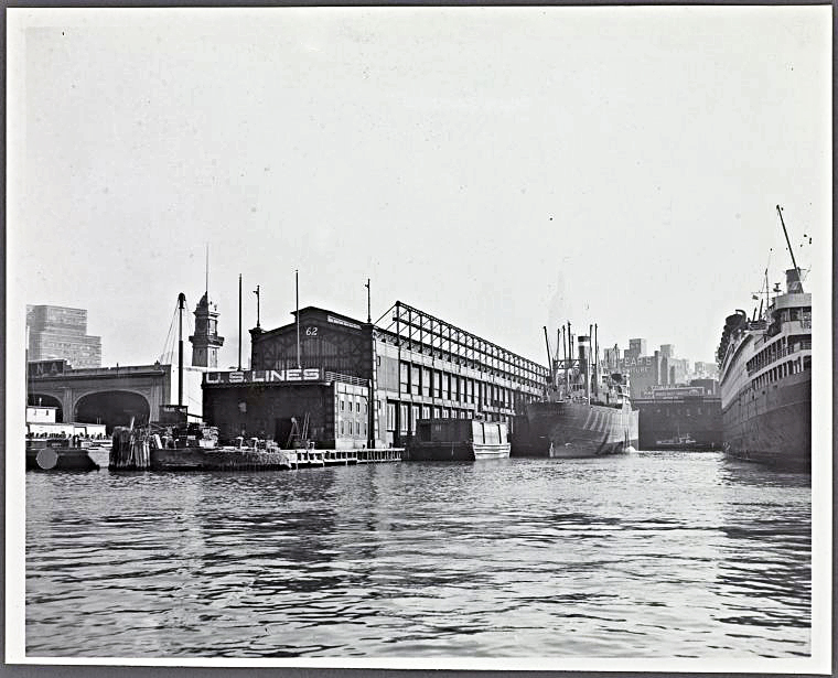 Pier 62 photographed from the river, 1951, showing the U.S. Lines pier shed and, in the distance, the Spears Co. furniture warehouse on 22nd Street. Photo: New York Public Library, Irma and Paul Milstein Division of United States History, Local History and Genealogy