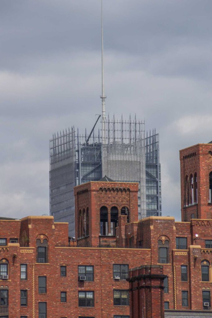 Beautiful brick towers for water tanks atop the London Terrace Apartments, with the New York Times headquarters in the distance. Photo: Annik LaFarge, author of On the High Line